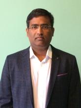 A head and shoulders photograph of Dr Aravindan Veiraiah.